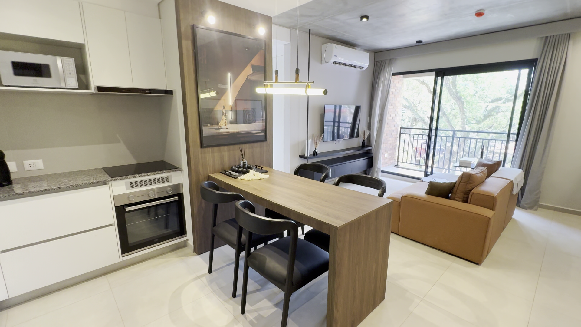 Furnished sample one-bedroom unit interior at Project Cumbres