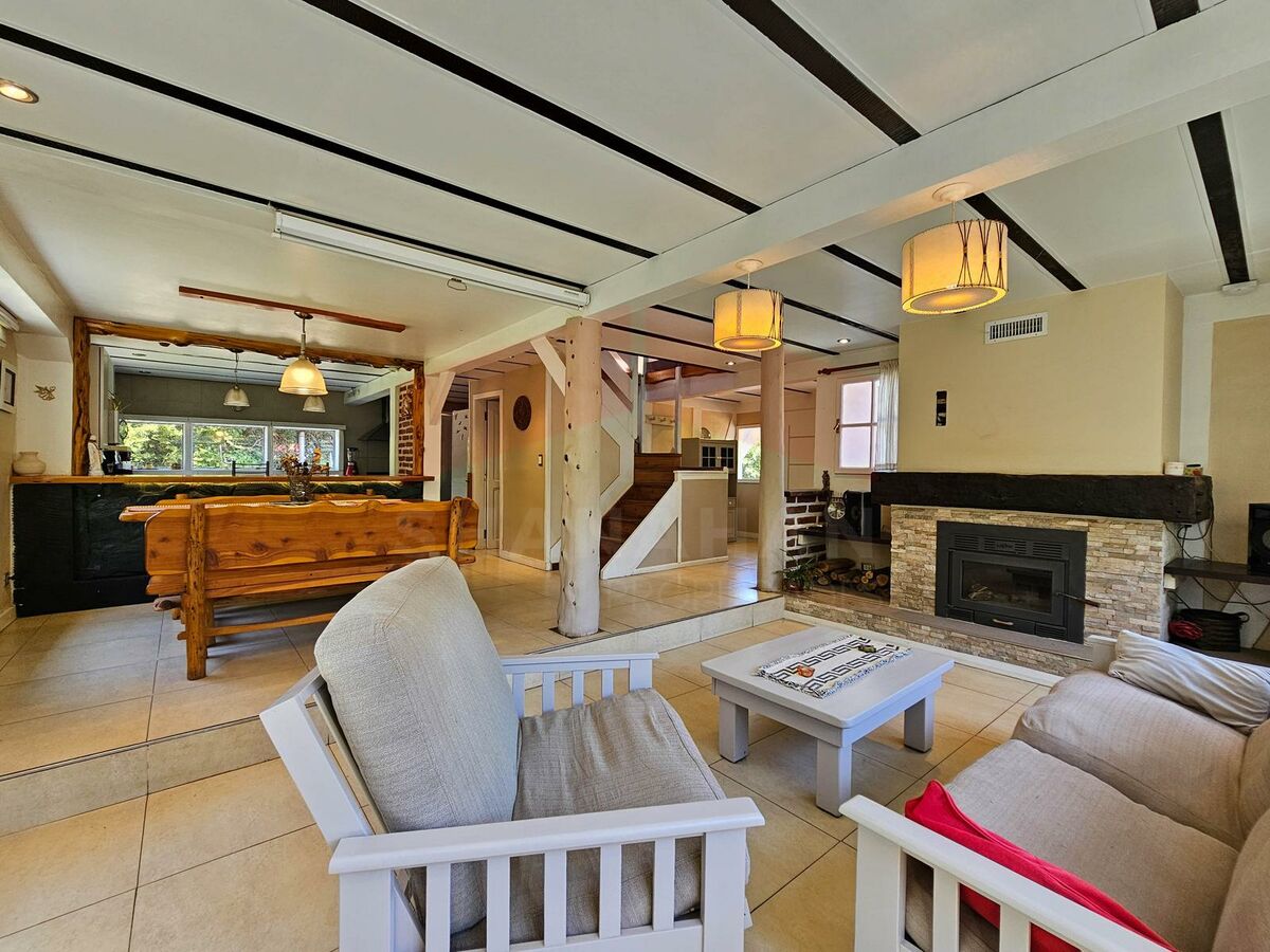 The bright, traditional main living area at Los Quetros