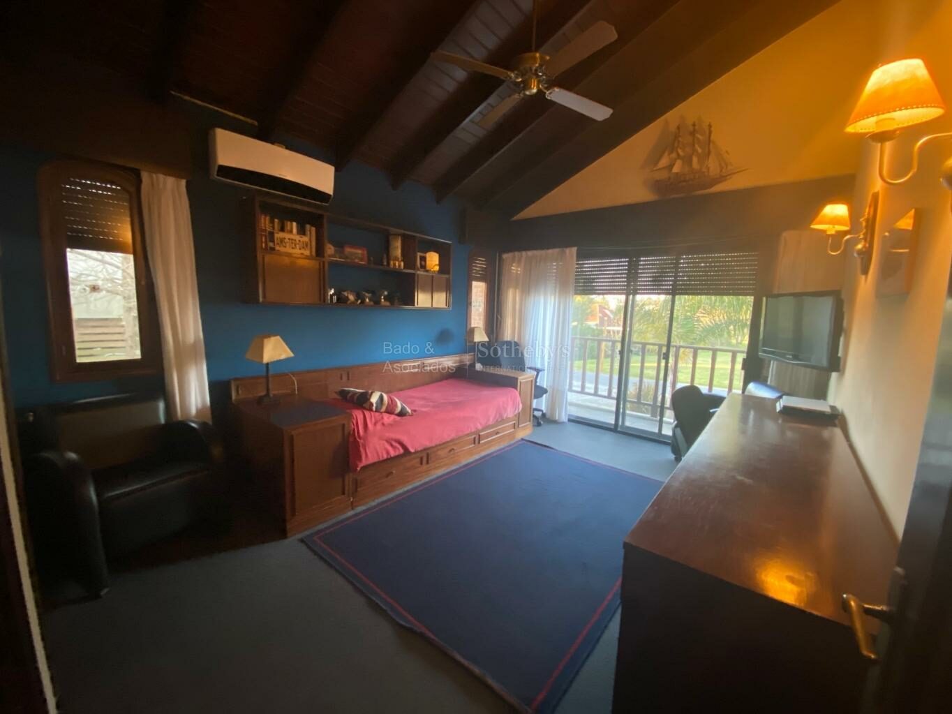 Upstairs sitting room under exposed timber beams