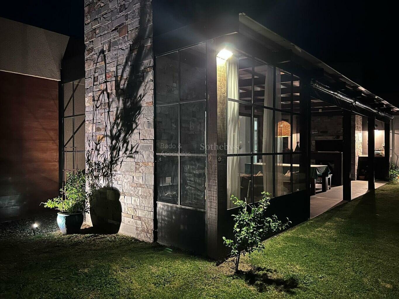 House exterior and glazing lit at night