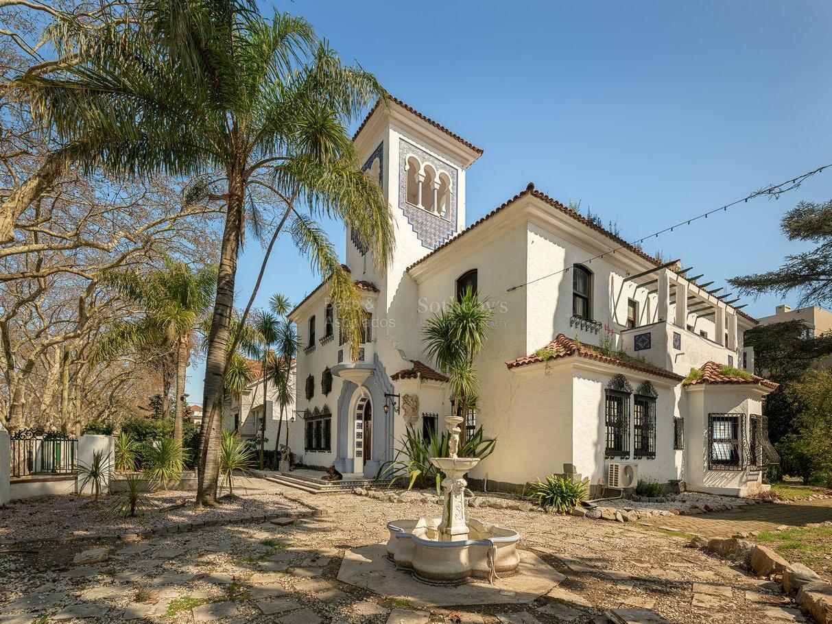 The 1924 villa in Prado with its tower, tiled roof and garden