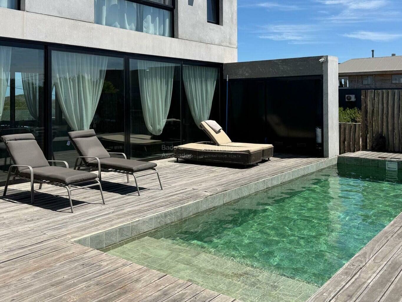 Pool deck and rear exterior of the house