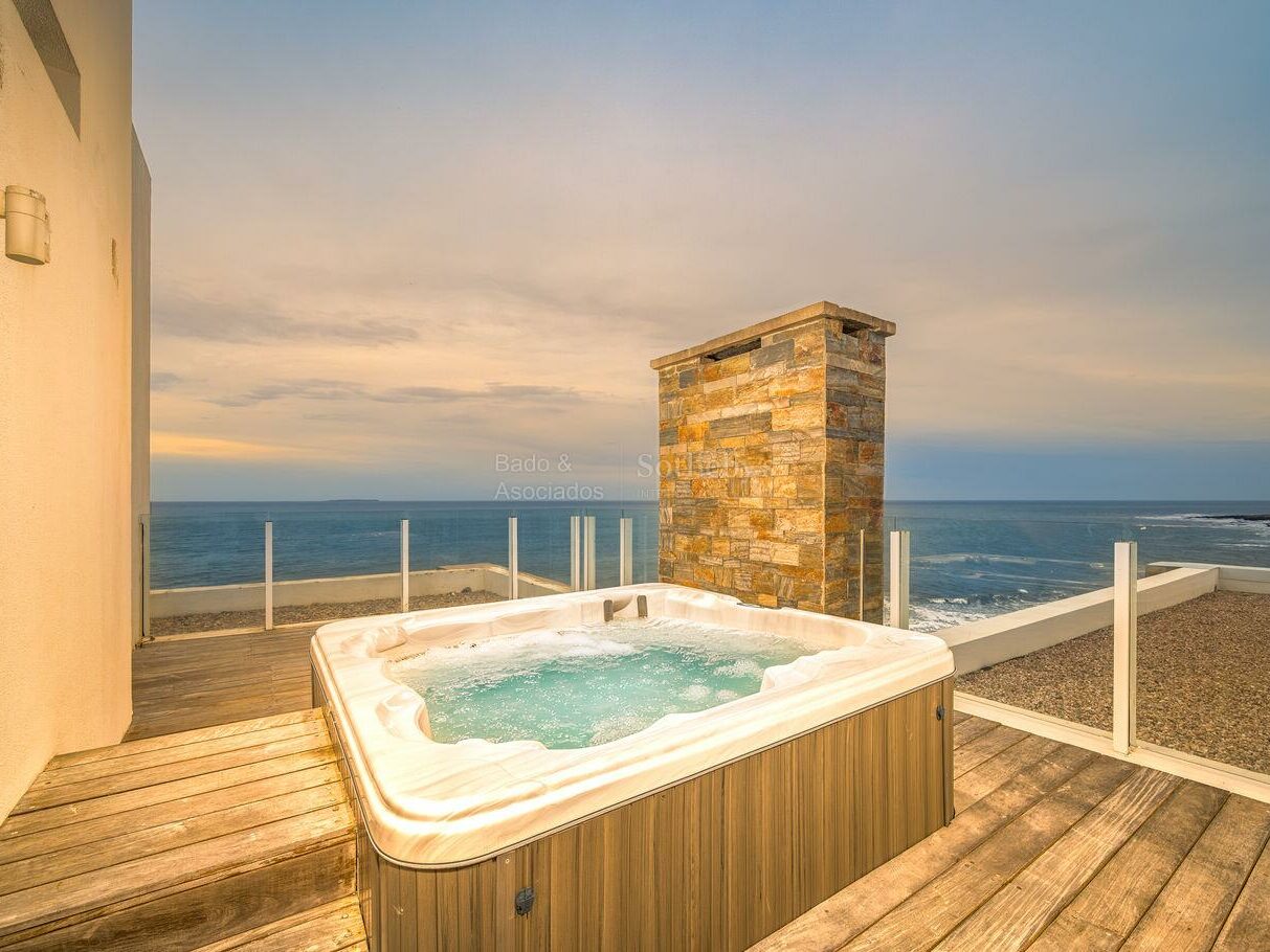 Private jacuzzi on the upper level of the Bonaire I penthouse overlooking the sea