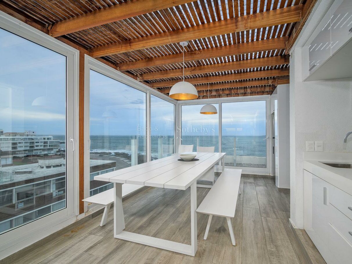 Glazed barbecue and dining space on the private upper level of the Bonaire I penthouse