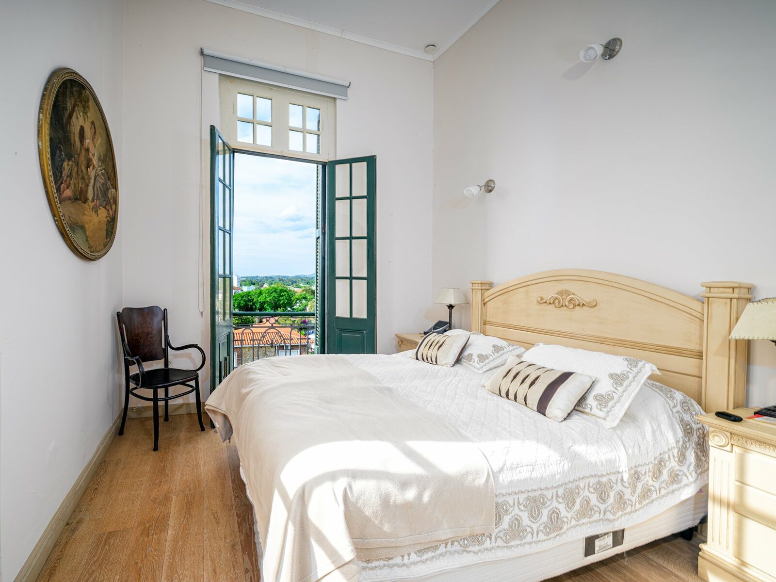 Bedroom with a door opening onto a balcony