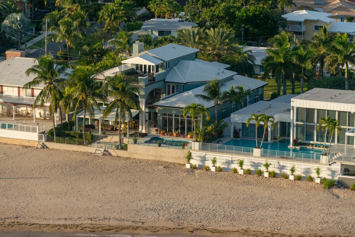 Beachfront mansion with palm trees and a pool on the Brazilian coast
